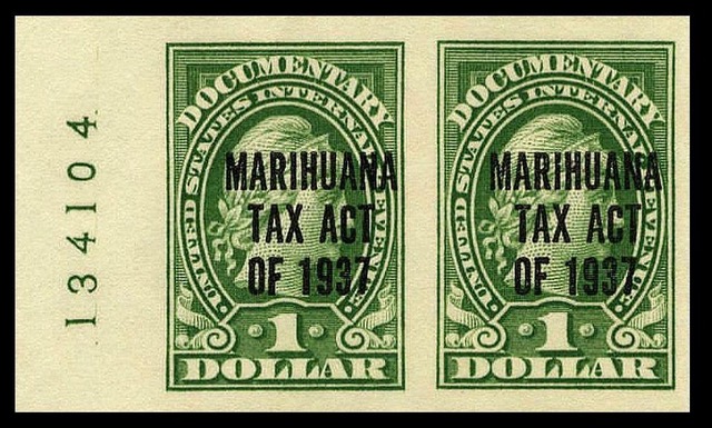 Although it was still legal to grow, sell, buy and possess cannabis, the exorbitant new taxes for everyone in the supply chain made it impossible to do any of those. Photo of Marihuana Tax Act Stamp /U.S. Bureau of Engraving and Printing; Imaging by Gwillhickers, Public domain, via Wikimedia Commons 